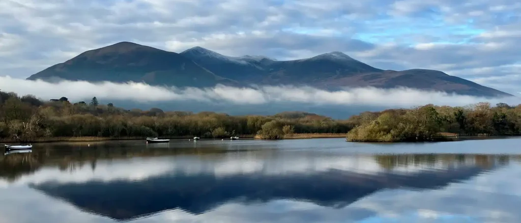 “Muckross Lake in Killarney National Park with mountains in the background”